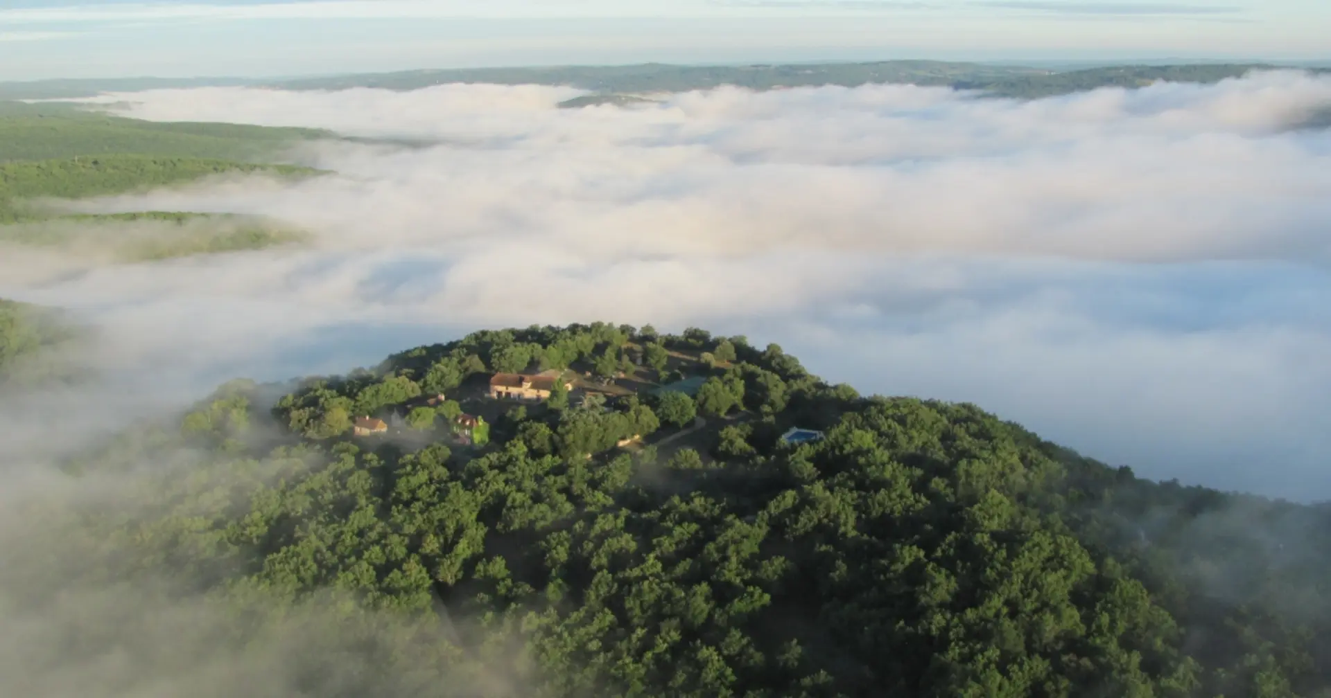 Aerial view of Domaine de Gayfié with morning mist
